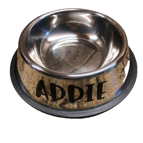 Close up of a stainless steel food bowl with the name Addie.