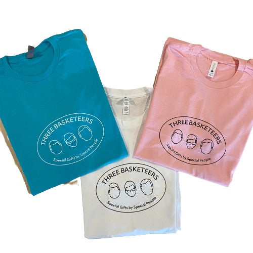 Three folded t-shirts with the Three Basketeers logo