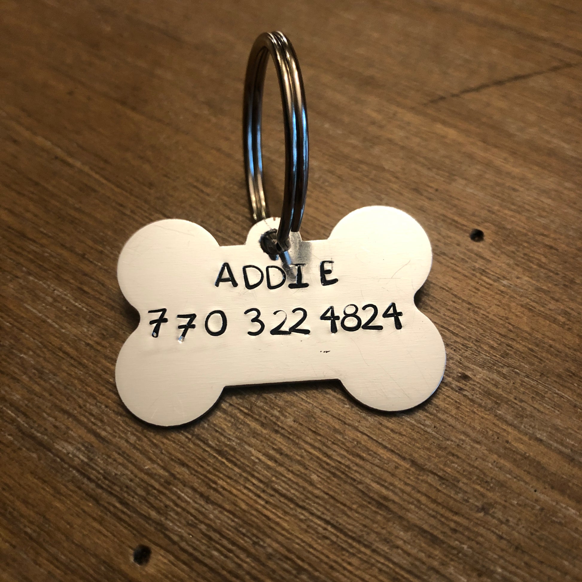 Dog tag with name and phone number