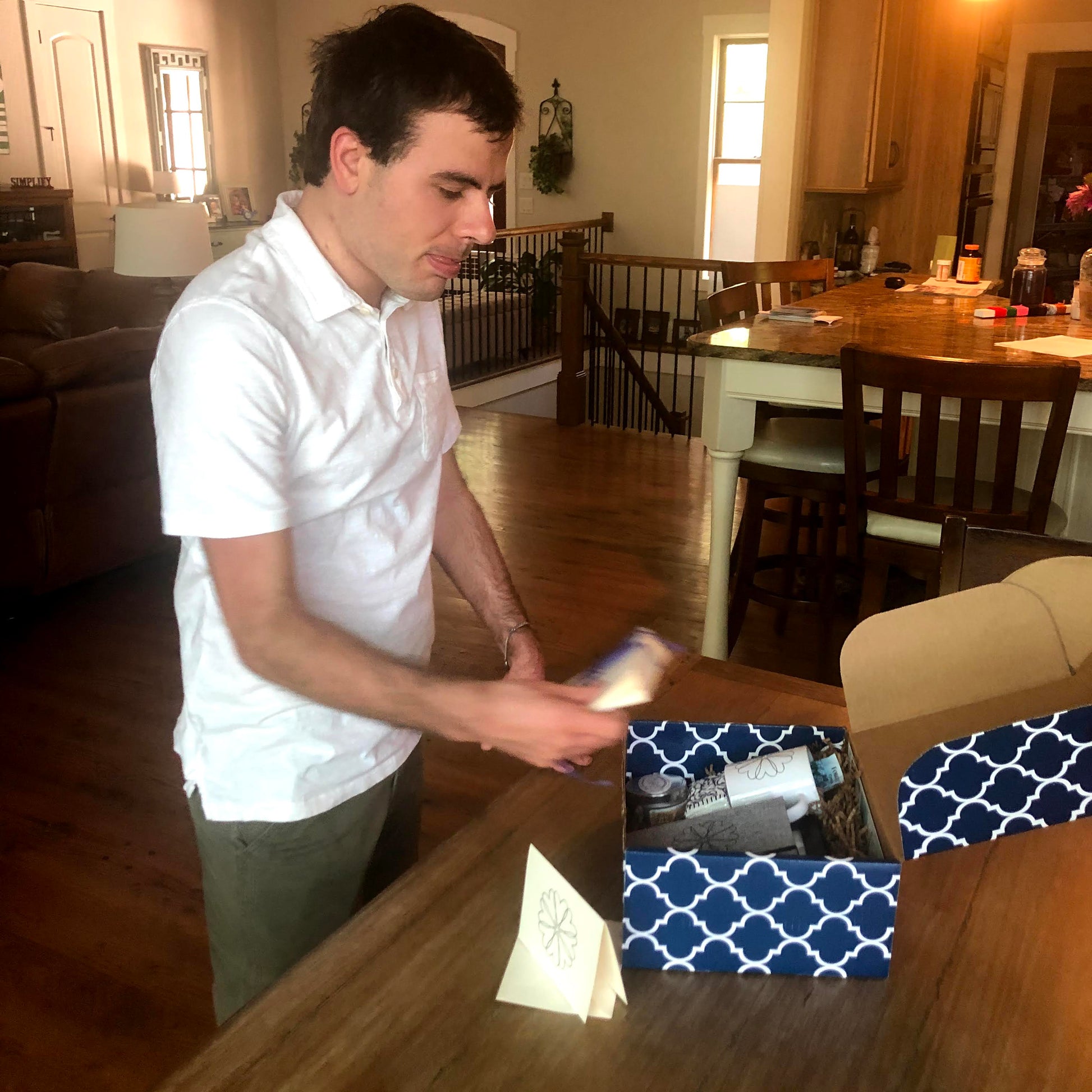 Disabled employee assembling sympathy gift box