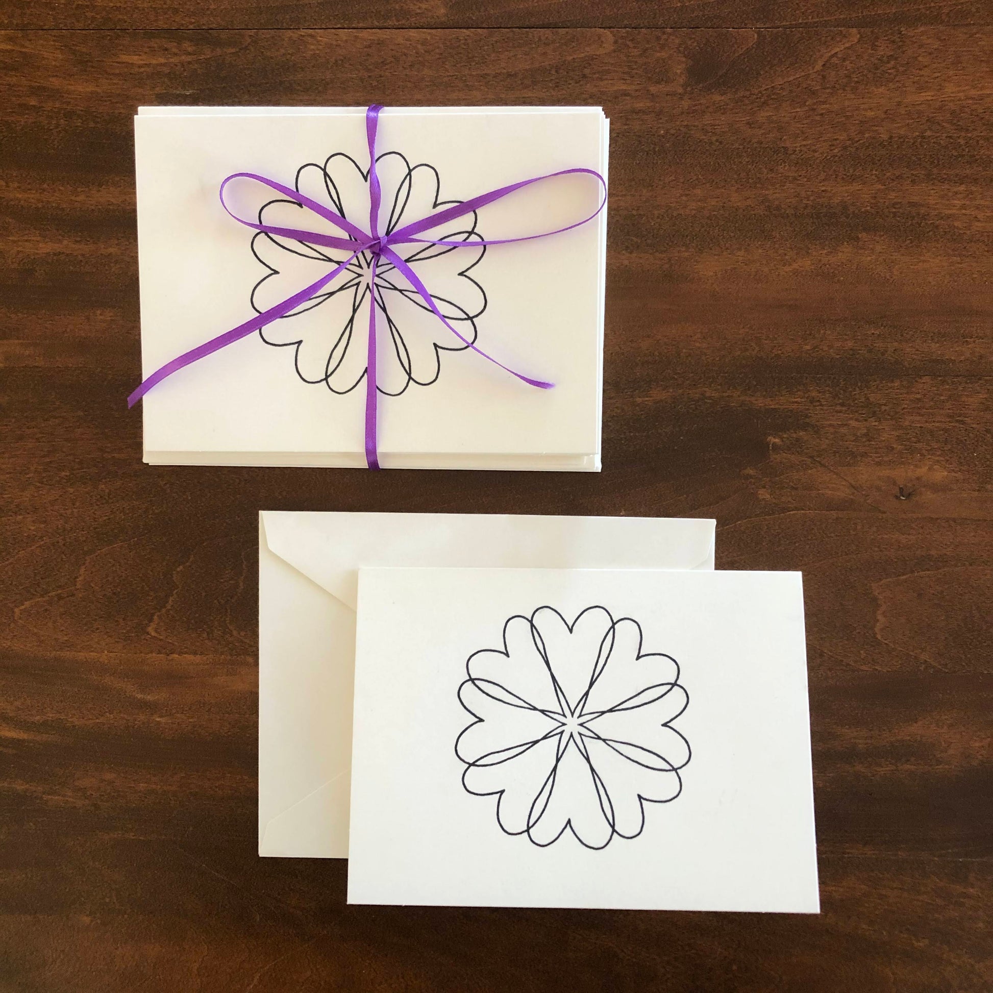Notecard with a heart wreath design on off white card